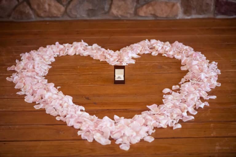 Rose petal heart with engagement ring