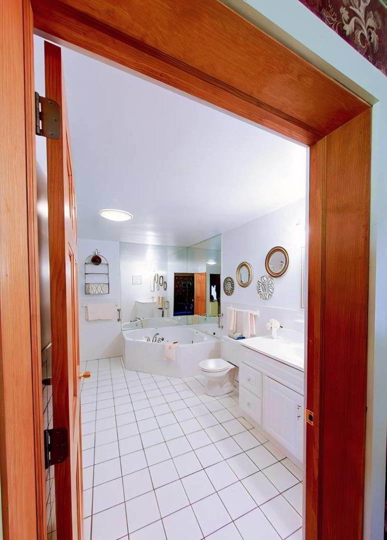 Bathroom with white tile. Poconos Lodging.