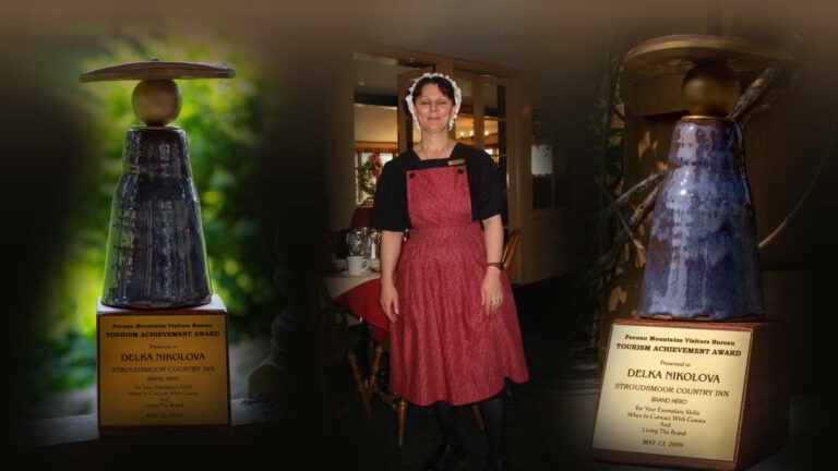 Resort staff member standing in the main inn - award overlays