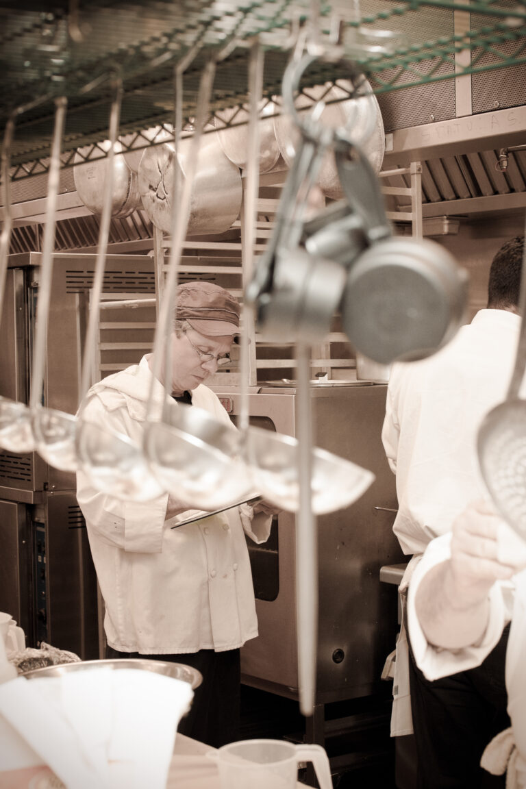 Chef looks over menu in Terraview kitchen