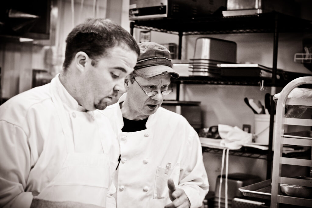 Chefs prep together in Terraview kitchen