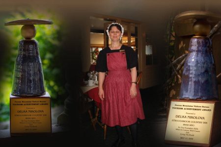 Resort staff member standing in the main inn - award overlays